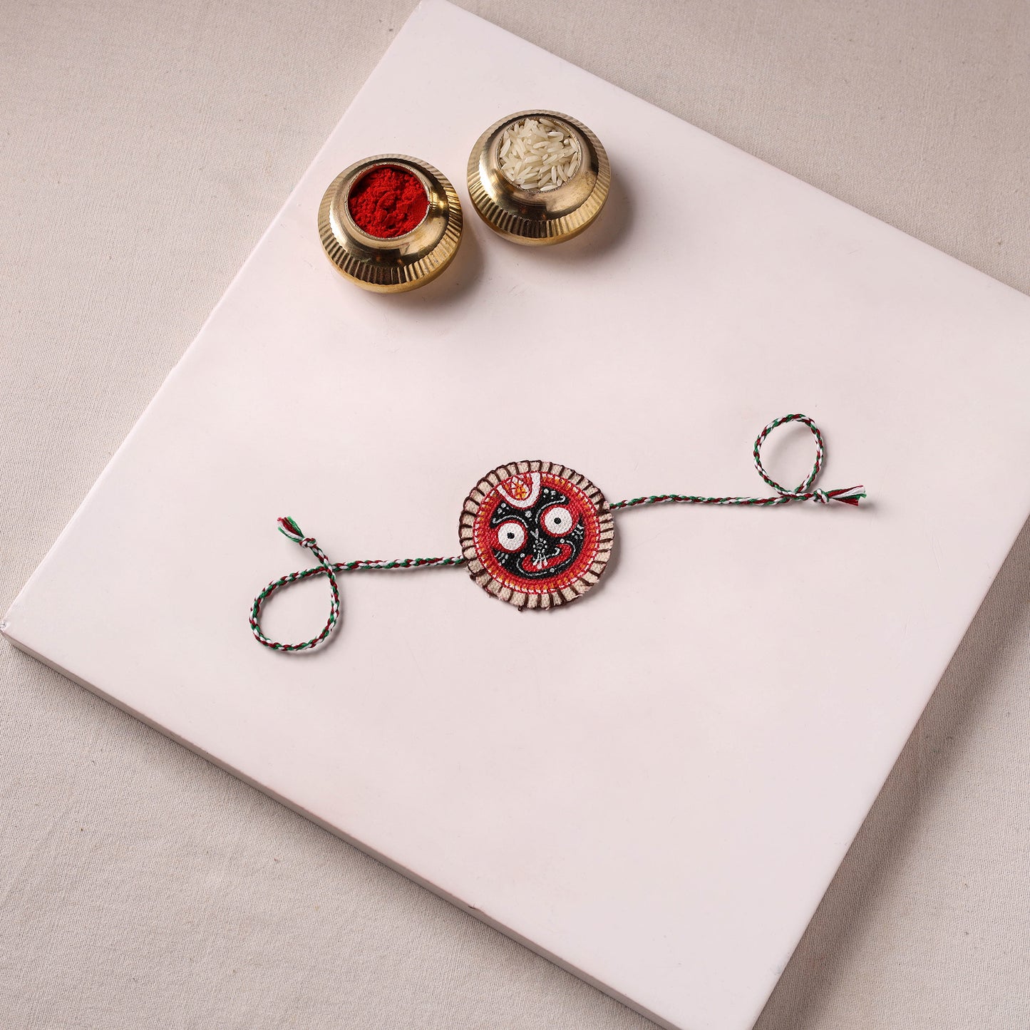Lord Jagannath - Reusable Pattachitra Handpainted Rakhi with Potli 06