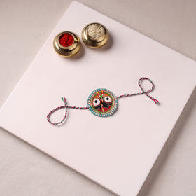 Lord Jagannath - Reusable Pattachitra Handpainted Rakhi with Potli 08