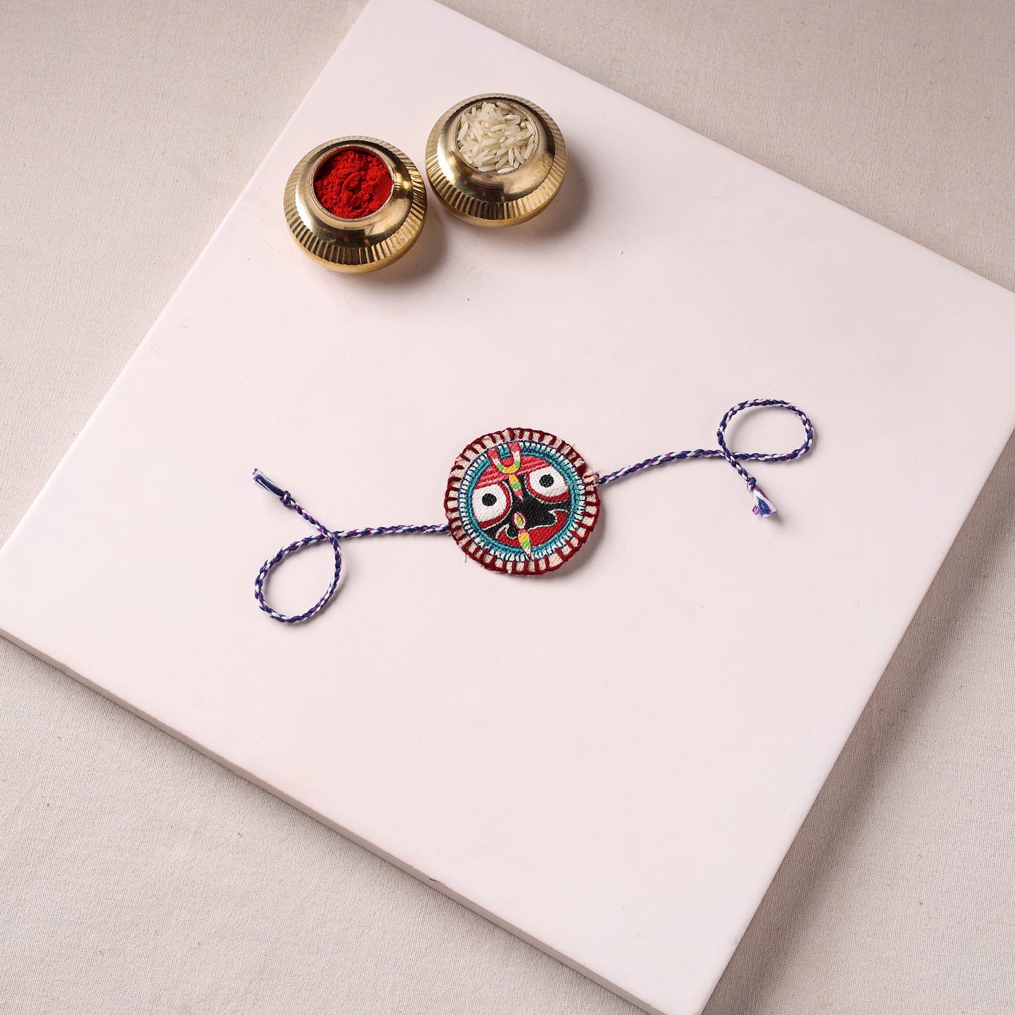 Lord Jagannath - Reusable Pattachitra Handpainted Rakhi with Potli 11