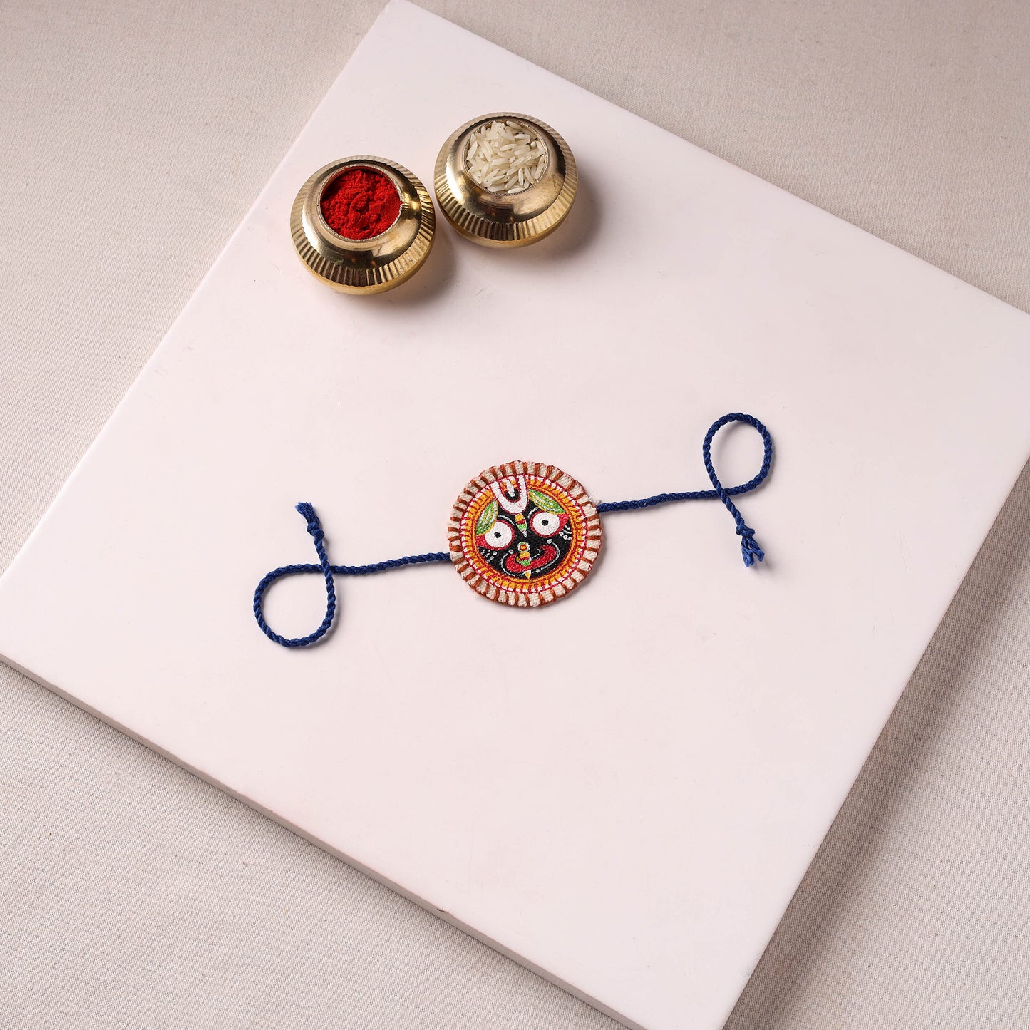 Lord Jagannath - Reusable Pattachitra Handpainted Rakhi with Potli 12