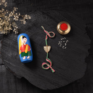 Multicolor - Handcrafted Tribal Dokra Brass Thread Rakhi with Banaras Wood Doll Box 01