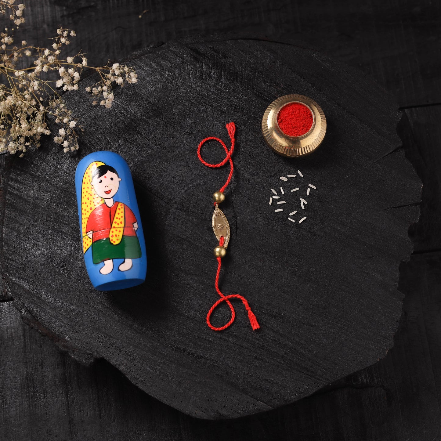 Red - Handcrafted Tribal Dokra Brass Thread Rakhi with Banaras Wood Doll Box 02