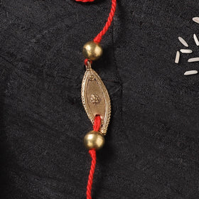 Red - Handcrafted Tribal Dokra Brass Thread Rakhi with Banaras Wood Doll Box 02