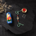 Green - Handcrafted Tribal Dokra Brass Thread Rakhi with Banaras Wood Doll Box 03