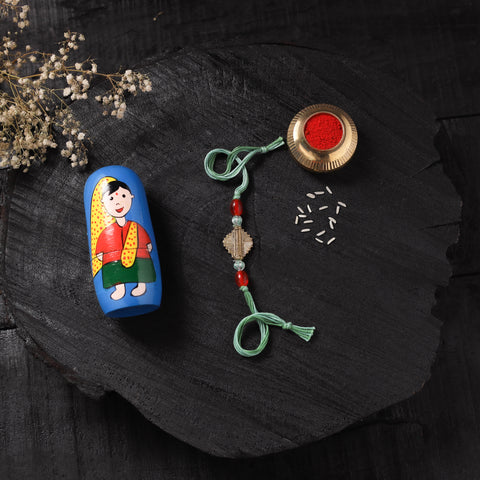 Green - Handcrafted Tribal Dokra Brass Thread Rakhi with Banaras Wood Doll Box 03