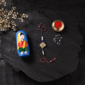 Multicolor - Handcrafted Tribal Dokra Brass Thread Rakhi with Banaras Wood Doll Box 04