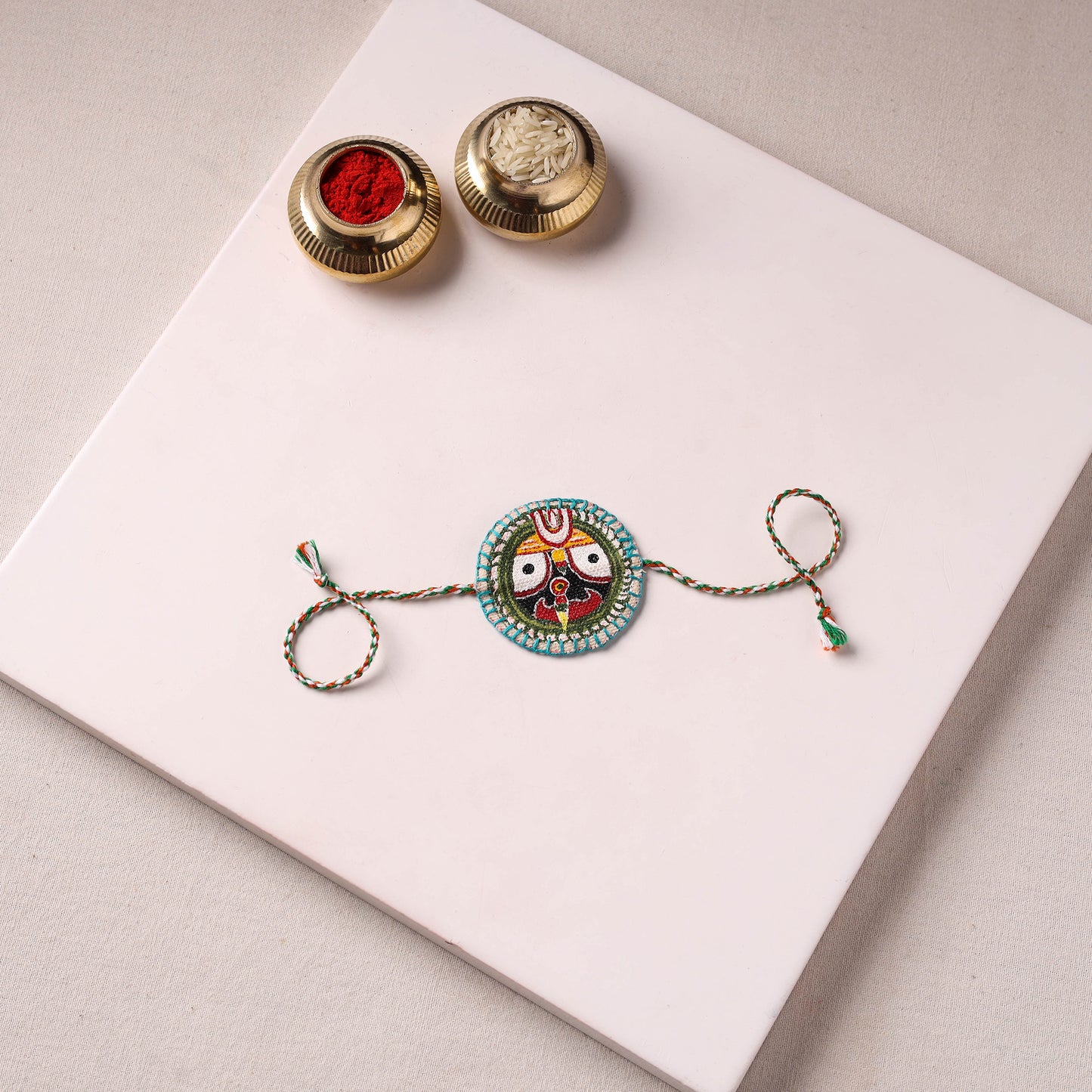 Lord Jagannath - Reusable Pattachitra Handpainted Rakhi with Potli 27
