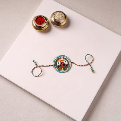 Lord Jagannath - Reusable Pattachitra Handpainted Rakhi with Potli 27
