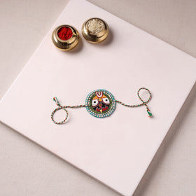 Lord Jagannath - Reusable Pattachitra Handpainted Rakhi with Potli 27