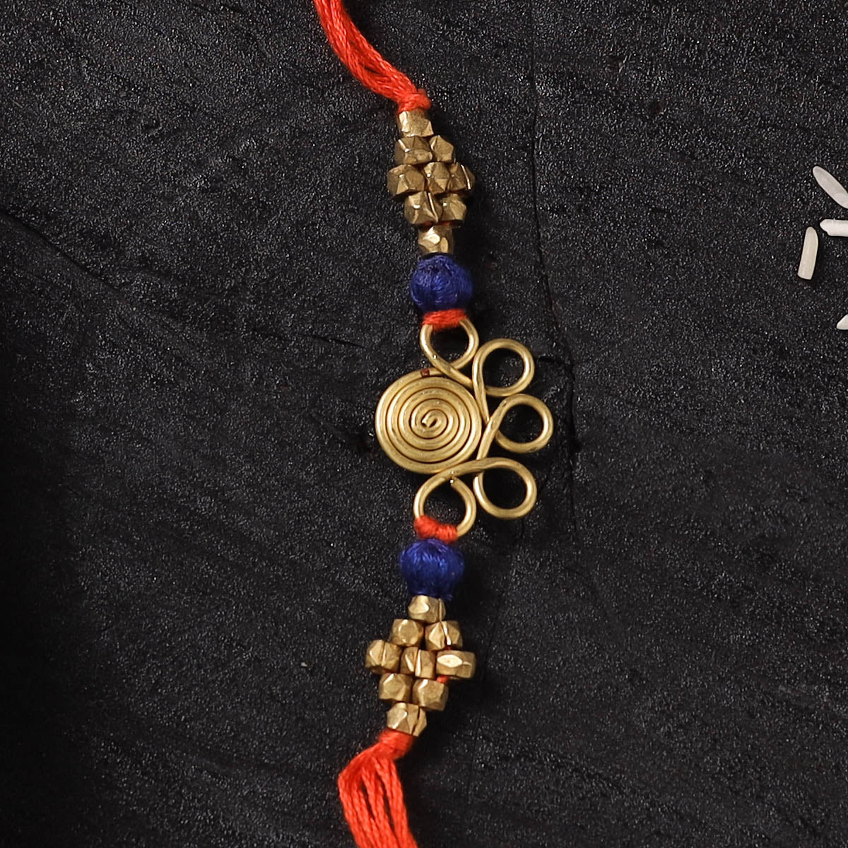 Orange - Handcrafted Tribal Dokra Brass Thread Rakhi with Banaras Wood Doll Box 05