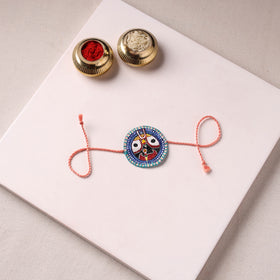 Lord Jagannath - Reusable Pattachitra Handpainted Rakhi with Potli 29