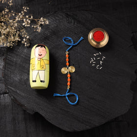Blue - Handcrafted Tribal Dokra Brass Thread Rakhi with Banaras Wood Doll Box 10