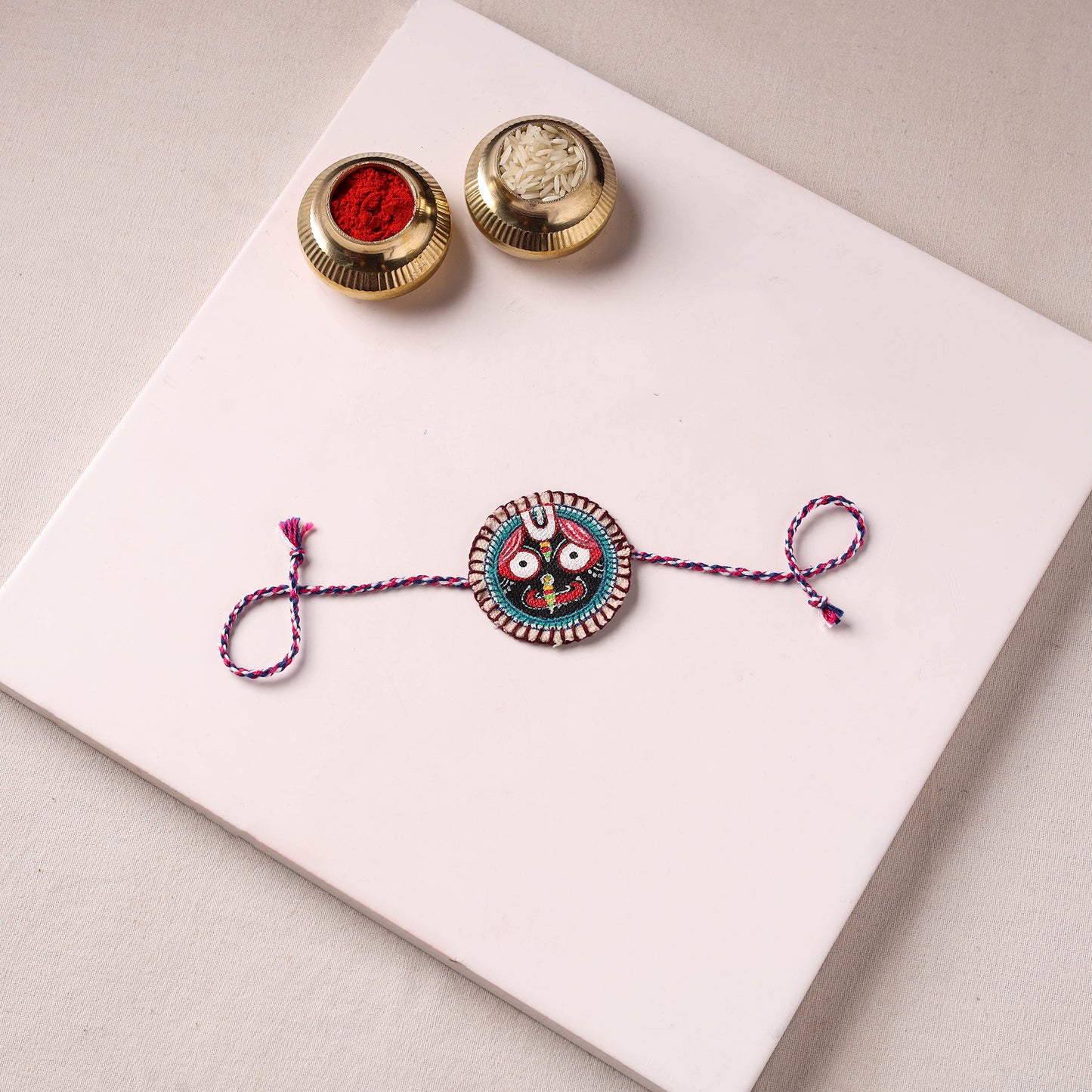 Lord Jagannath - Reusable Pattachitra Handpainted Rakhi with Potli 33