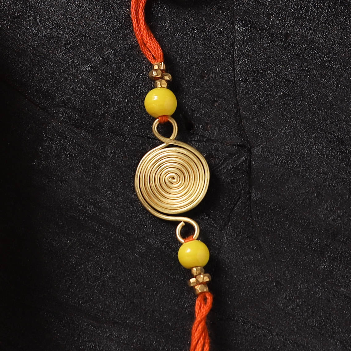 Orange - Handcrafted Tribal Dokra Brass Thread Rakhi with Banaras Wood Doll Box 12