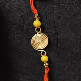 Orange - Handcrafted Tribal Dokra Brass Thread Rakhi with Banaras Wood Doll Box 12