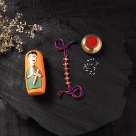 Multicolor - Handcrafted Tribal Dokra Brass Thread Rakhi with Banaras Wood Doll Box 14