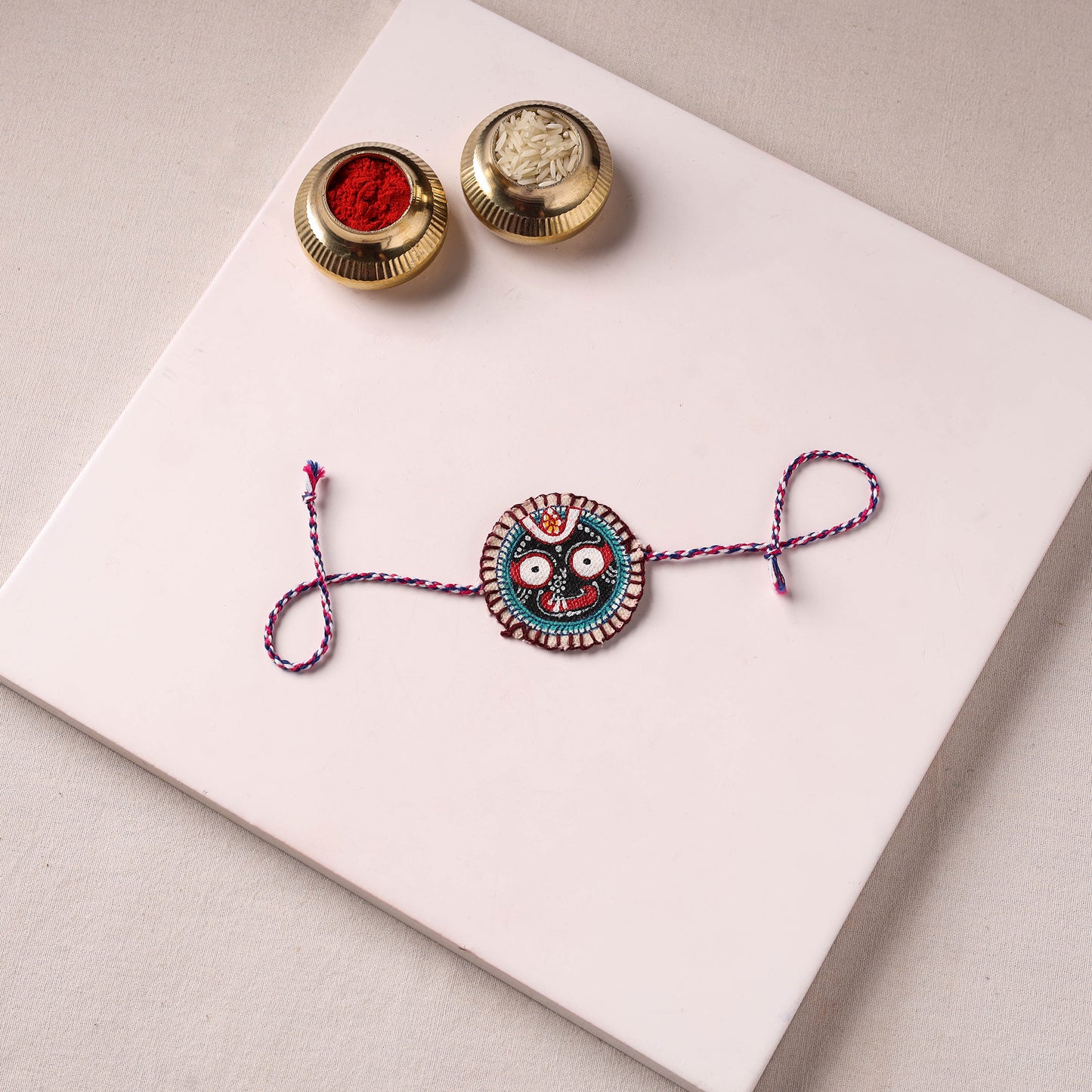 Lord Jagannath - Reusable Pattachitra Handpainted Rakhi with Potli 34