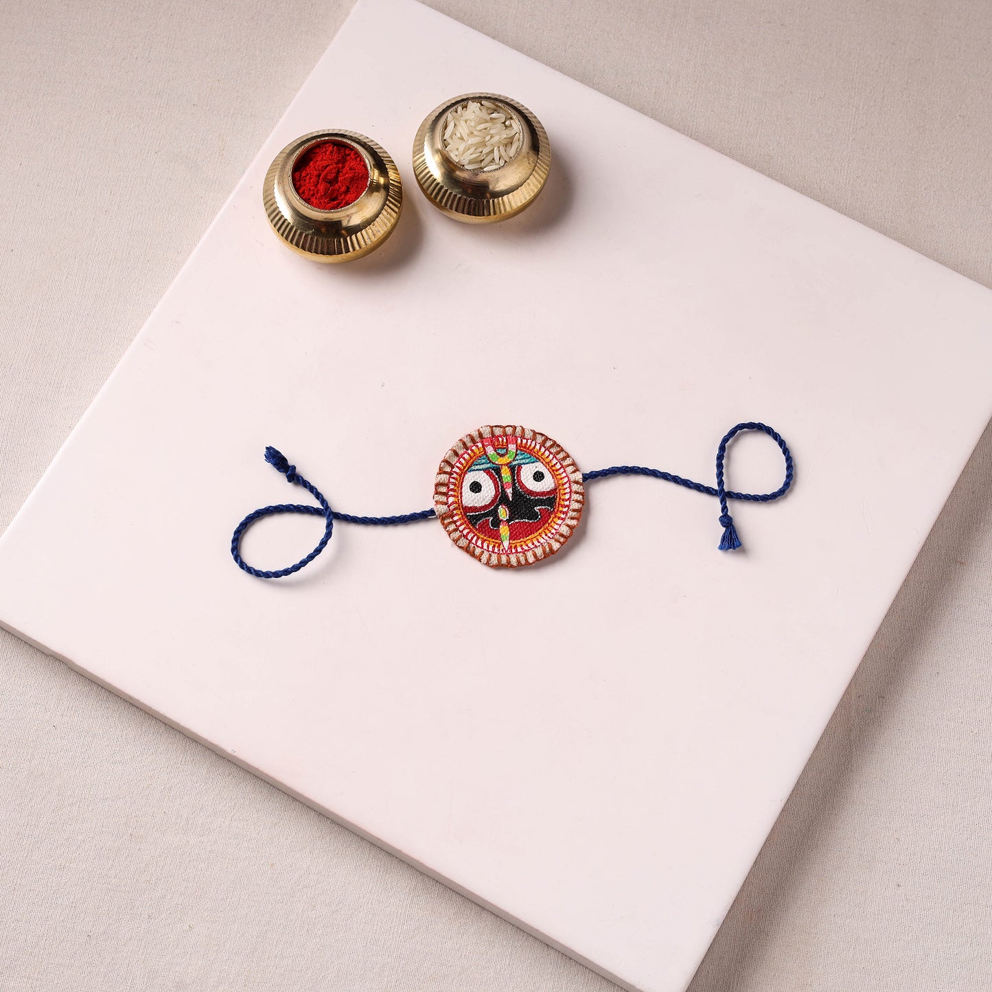 Lord Jagannath - Reusable Pattachitra Handpainted Rakhi with Potli 36