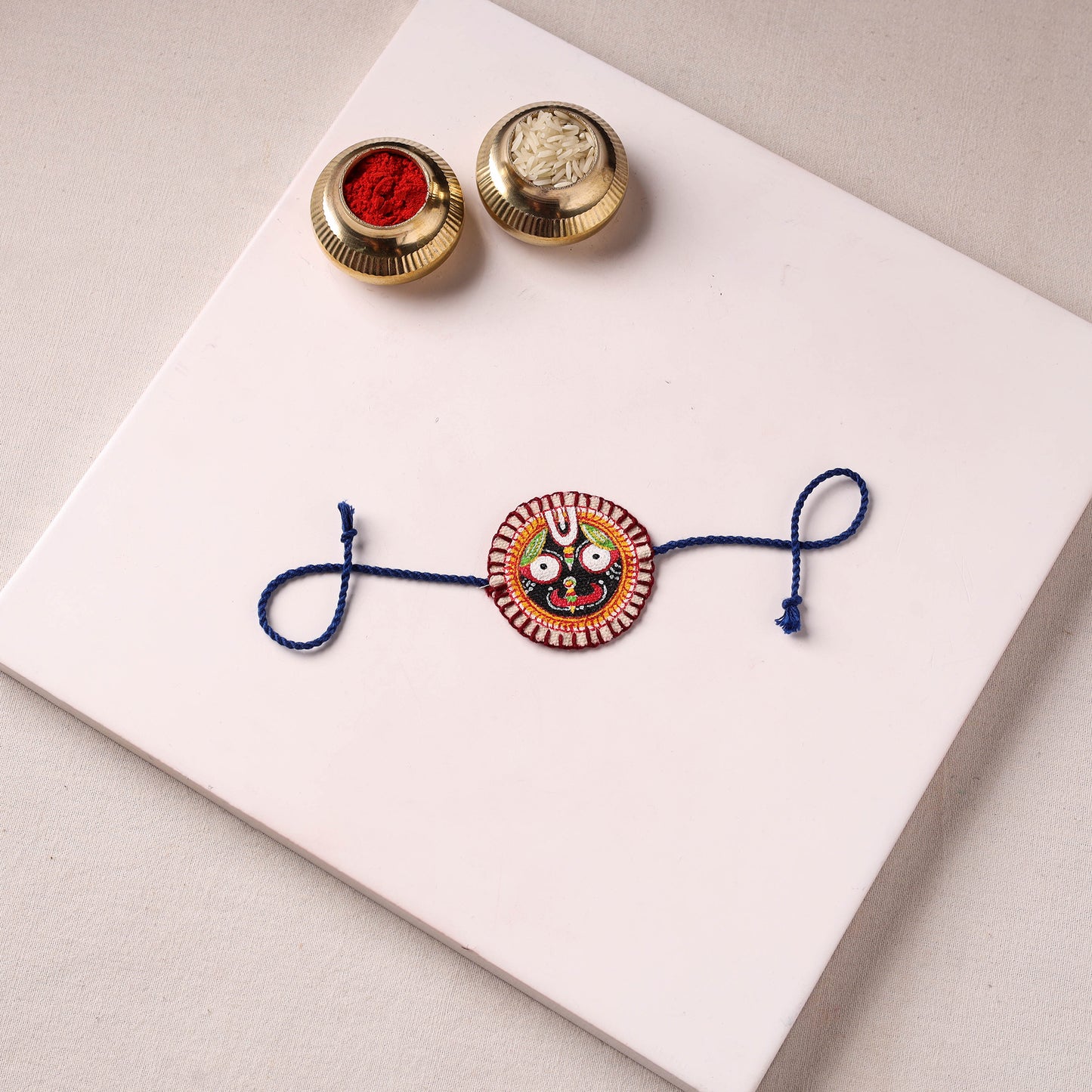 Lord Jagannath - Reusable Pattachitra Handpainted Rakhi with Potli 37