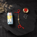 Red - Handcrafted Tribal Dokra Brass Thread Rakhi with Banaras Wood Doll Box 17