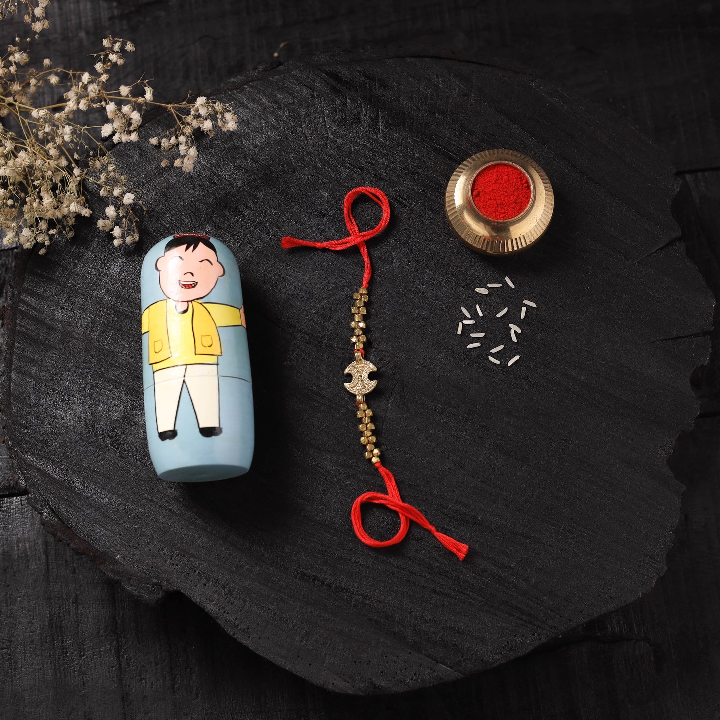 Red - Handcrafted Tribal Dokra Brass Thread Rakhi with Banaras Wood Doll Box 17