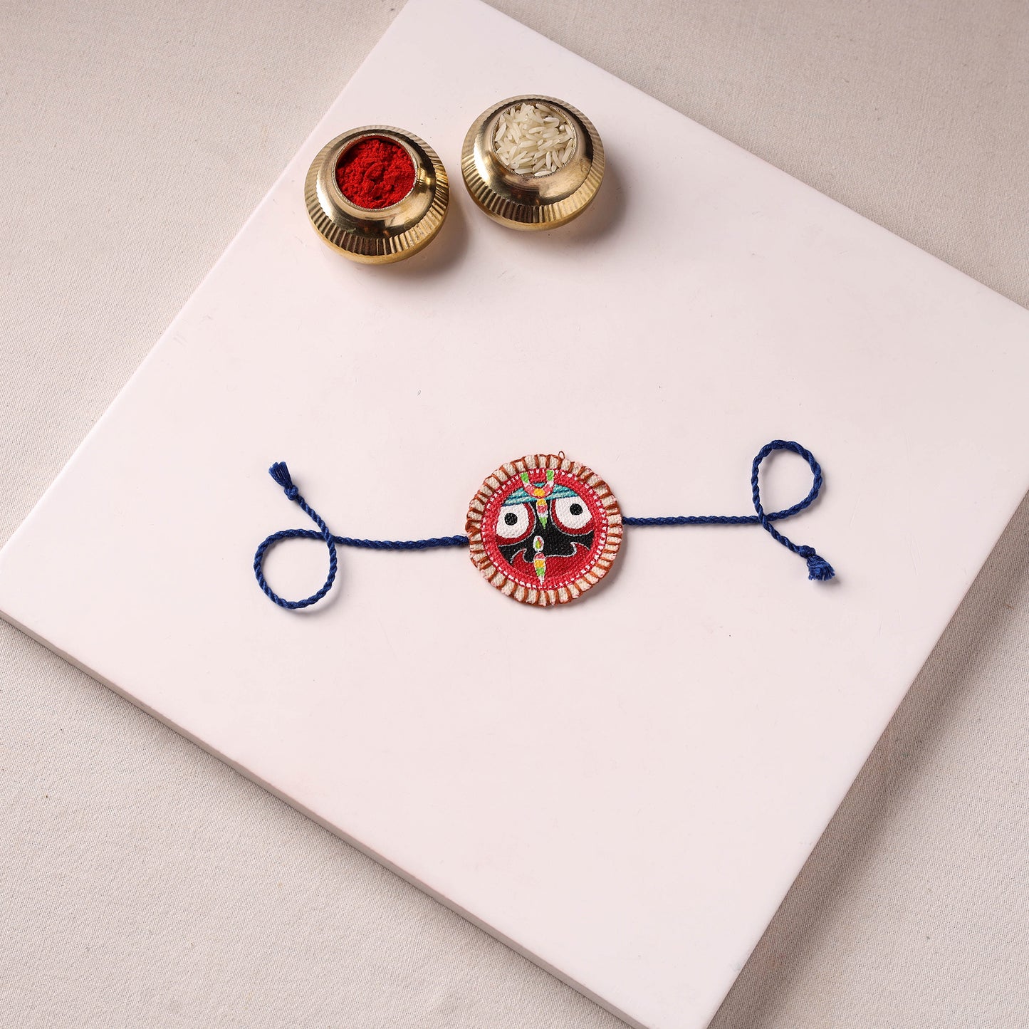 Lord Jagannath - Reusable Pattachitra Handpainted Rakhi with Potli 38