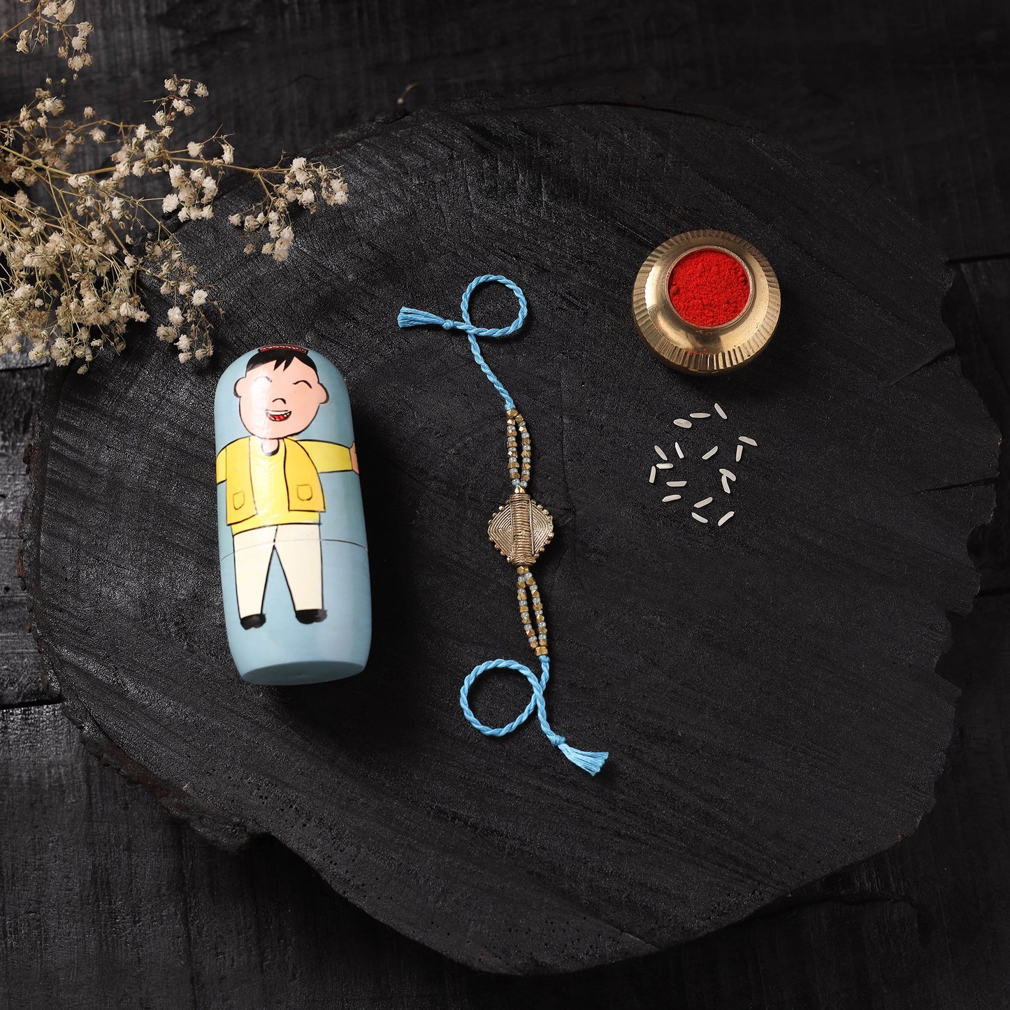Blue - Handcrafted Tribal Dokra Brass Thread Rakhi with Banaras Wood Doll Box 18