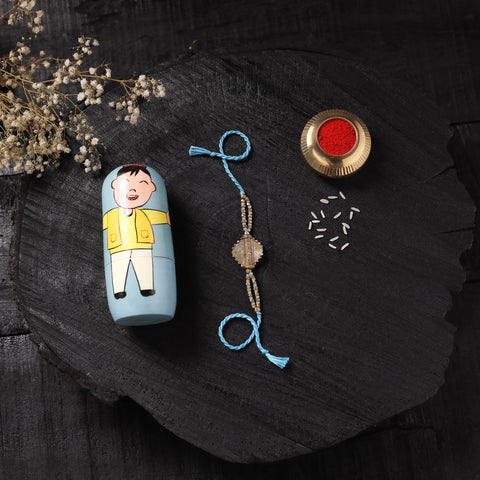 Blue - Handcrafted Tribal Dokra Brass Thread Rakhi with Banaras Wood Doll Box 18