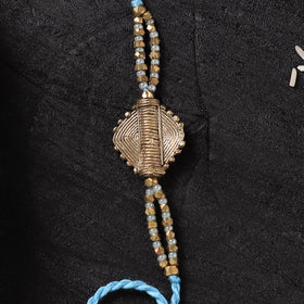 Blue - Handcrafted Tribal Dokra Brass Thread Rakhi with Banaras Wood Doll Box 18