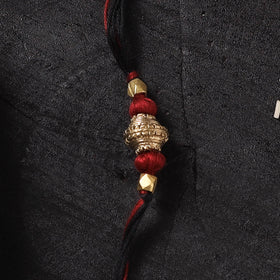 Multicolor - Handcrafted Tribal Dokra Brass Thread Rakhi with Banaras Wood Doll Box 19