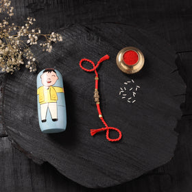 Red - Handcrafted Tribal Dokra Brass Thread Rakhi with Banaras Wood Doll Box 20