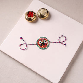 Lord Jagannath - Reusable Pattachitra Handpainted Rakhi with Potli 42