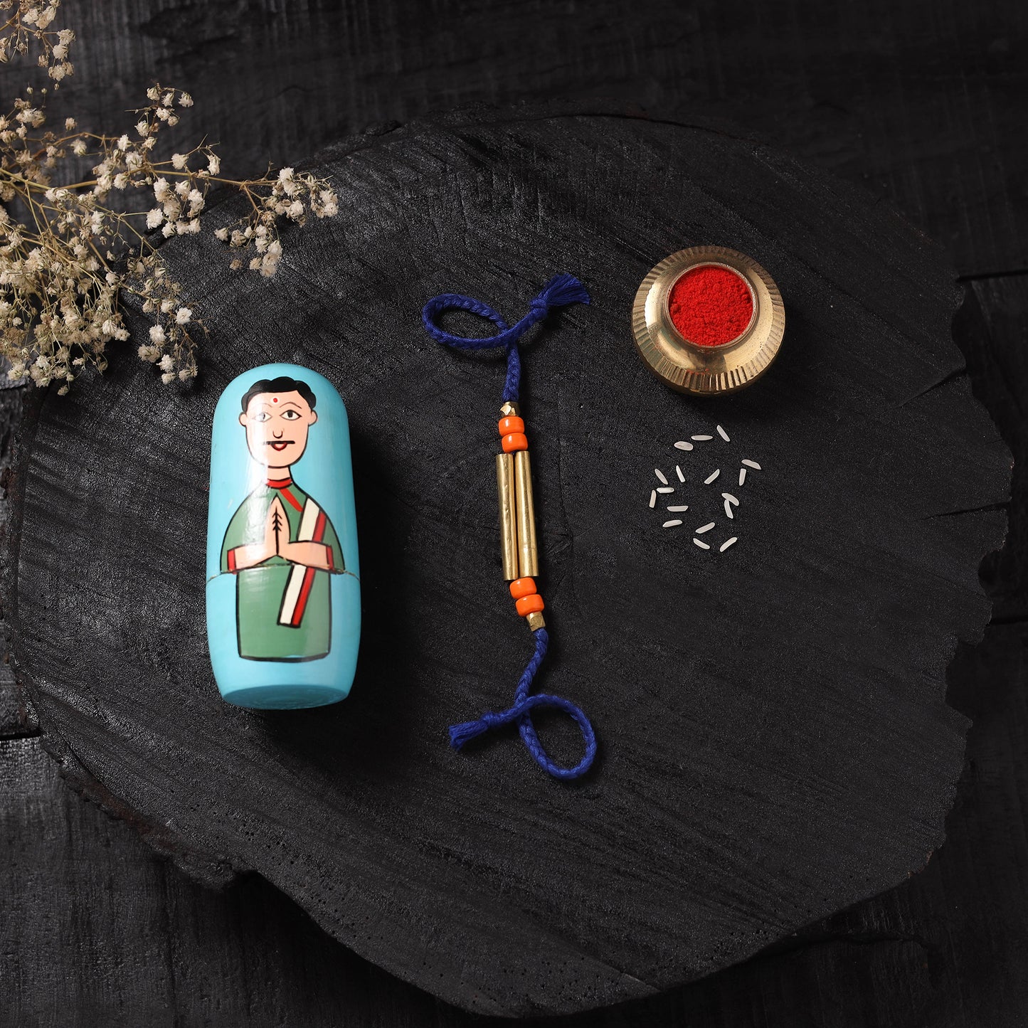 Blue - Handcrafted Tribal Dokra Brass Thread Rakhi with Banaras Wood Doll Box 21