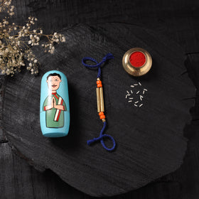 Blue - Handcrafted Tribal Dokra Brass Thread Rakhi with Banaras Wood Doll Box 21