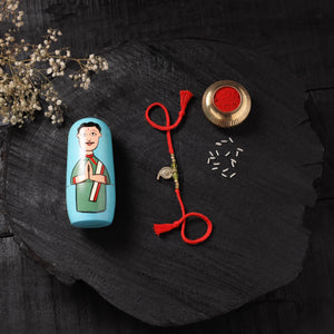 Red - Handcrafted Tribal Dokra Brass Thread Rakhi with Banaras Wood Doll Box 23