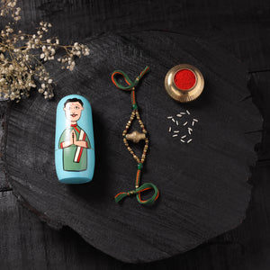 Multicolor - Handcrafted Tribal Dokra Brass Thread Rakhi with Banaras Wood Doll Box 25