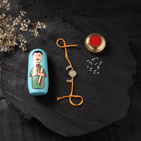 Yellow - Handcrafted Tribal Dokra Brass Thread Rakhi with Banaras Wood Doll Box 26