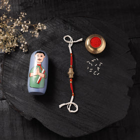 White - Handcrafted Tribal Dokra Brass Thread Rakhi with Banaras Wood Doll Box 27