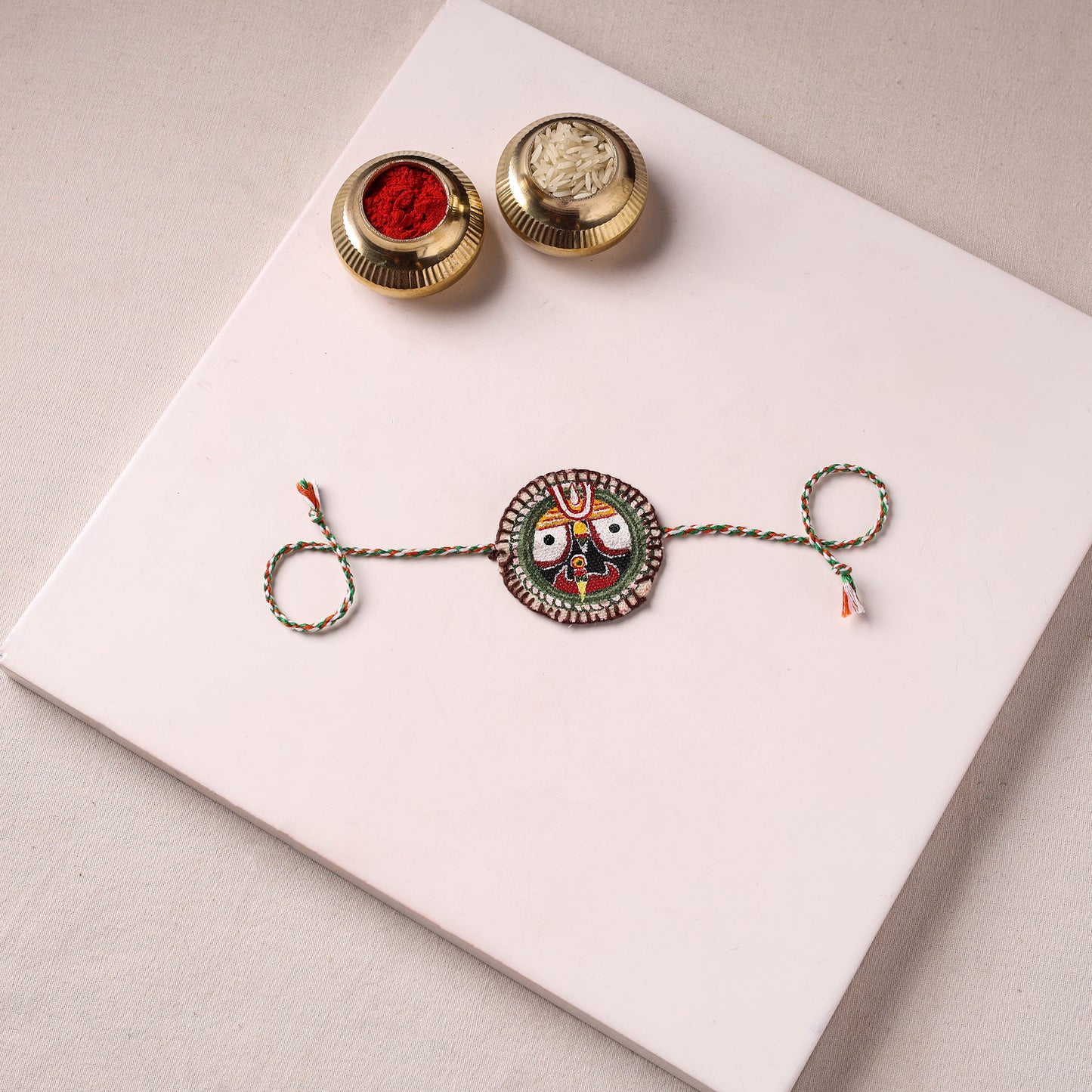 Lord Jagannath - Reusable Pattachitra Handpainted Rakhi with Potli 49