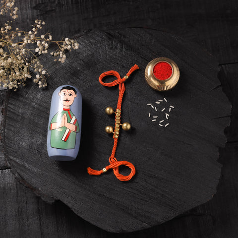Orange - Handcrafted Tribal Dokra Brass Thread Rakhi with Banaras Wood Doll Box 29