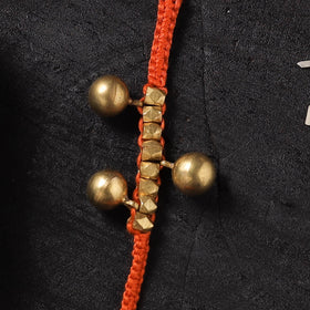 Orange - Handcrafted Tribal Dokra Brass Thread Rakhi with Banaras Wood Doll Box 29