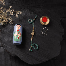 Green - Handcrafted Tribal Dokra Brass Thread Rakhi with Banaras Wood Doll Box 30