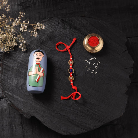 Red - Handcrafted Tribal Dokra Brass Thread Rakhi with Banaras Wood Doll Box 31