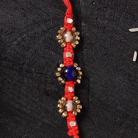 Red - Handcrafted Tribal Dokra Brass Thread Rakhi with Banaras Wood Doll Box 31