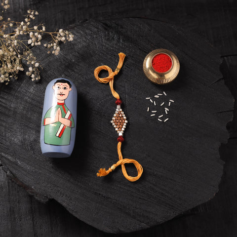 Yellow - Handcrafted Tribal Dokra Brass Thread Rakhi with Banaras Wood Doll Box 32
