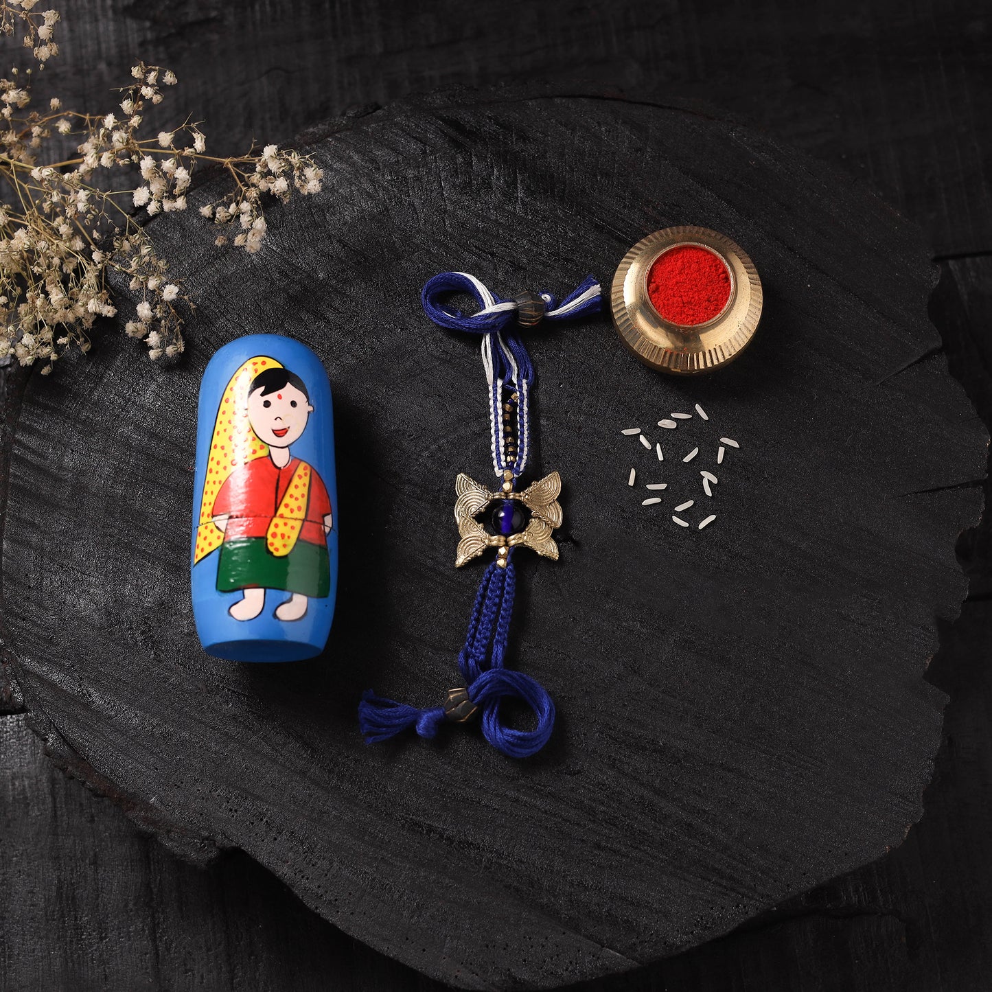Blue - Handcrafted Tribal Dokra Brass Thread Rakhi with Banaras Wood Doll Box 33