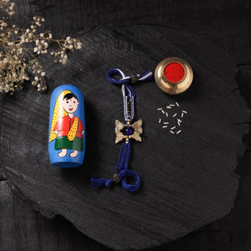 Blue - Handcrafted Tribal Dokra Brass Thread Rakhi with Banaras Wood Doll Box 33