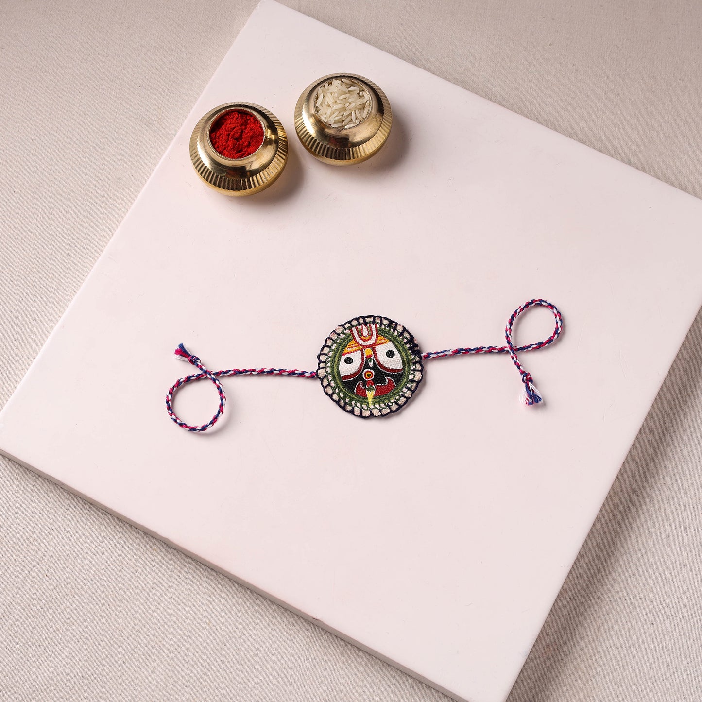 Lord Jagannath - Reusable Pattachitra Handpainted Rakhi with Potli 54