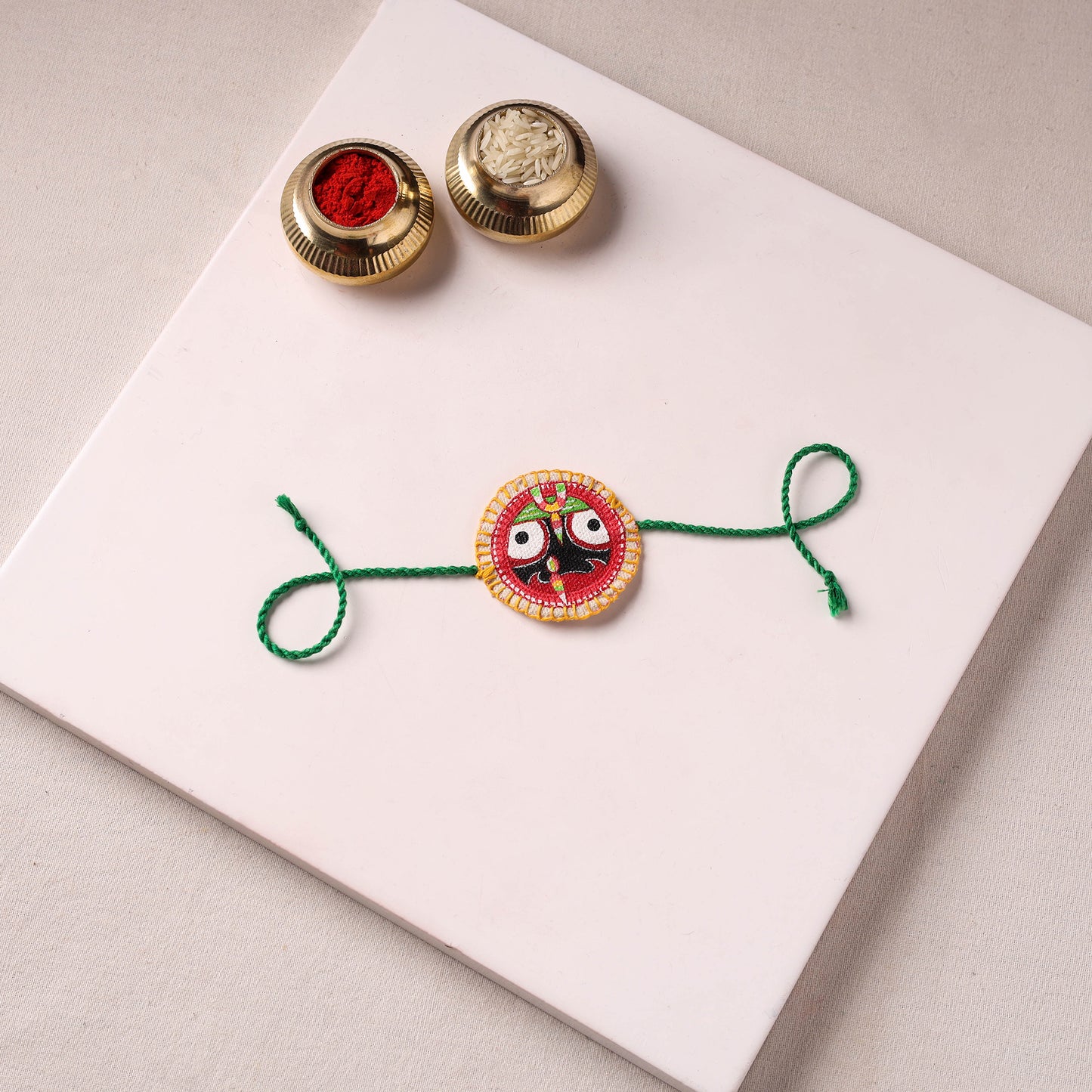Lord Jagannath - Reusable Pattachitra Handpainted Rakhi with Potli 55