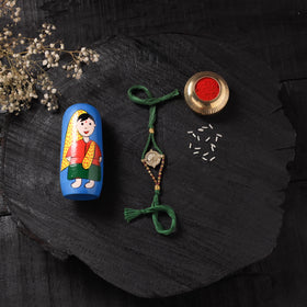 Green - Handcrafted Tribal Dokra Brass Thread Rakhi with Banaras Wood Doll Box 35